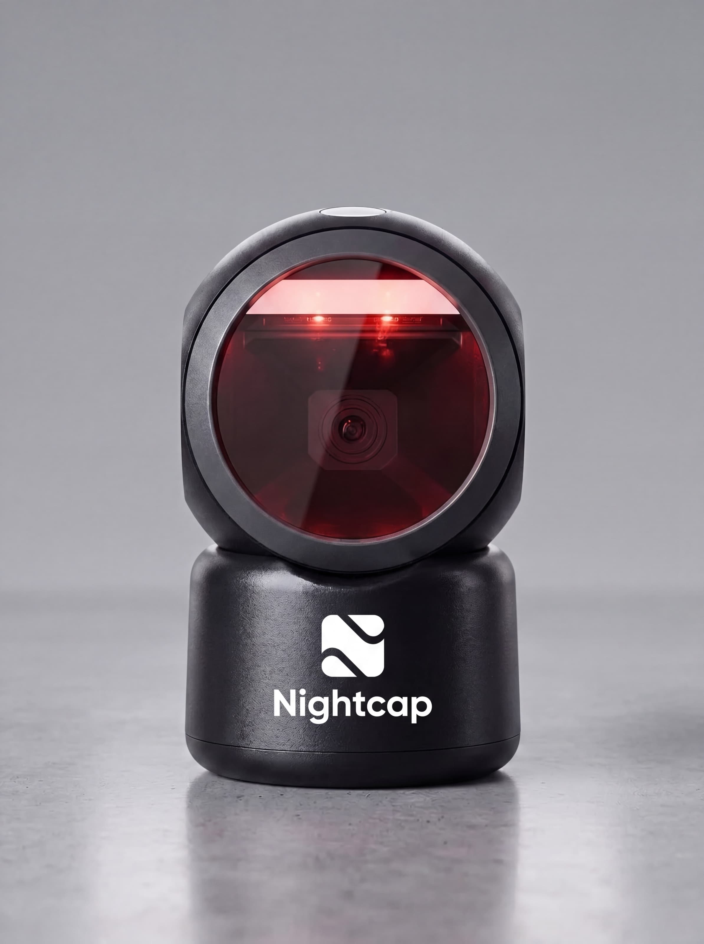 Omnidirectional desktop barcode scanner with visible red scan lines, sitting on a counter